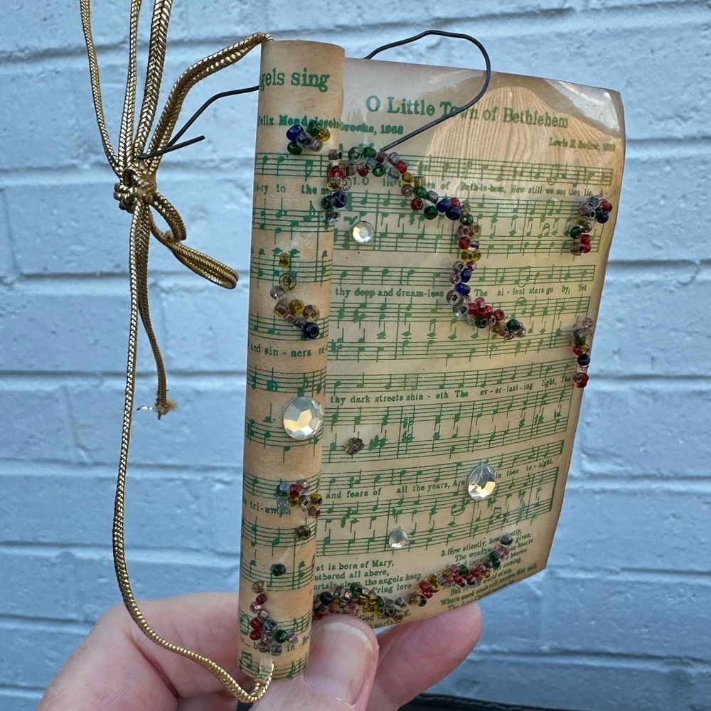 Vintage Sheet Music Ornament Wrapped in Plastic decorated with Beads and Jewels
